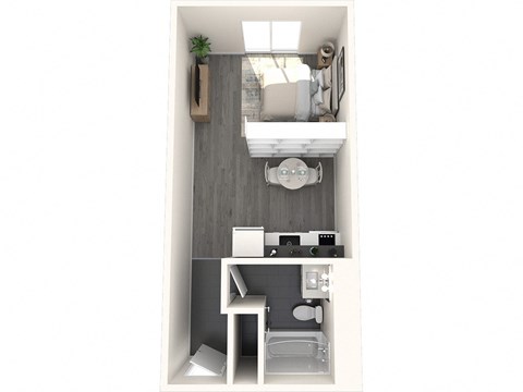 a bedroom with a desk and a chair in a small room